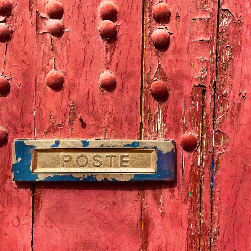 Red door with post box