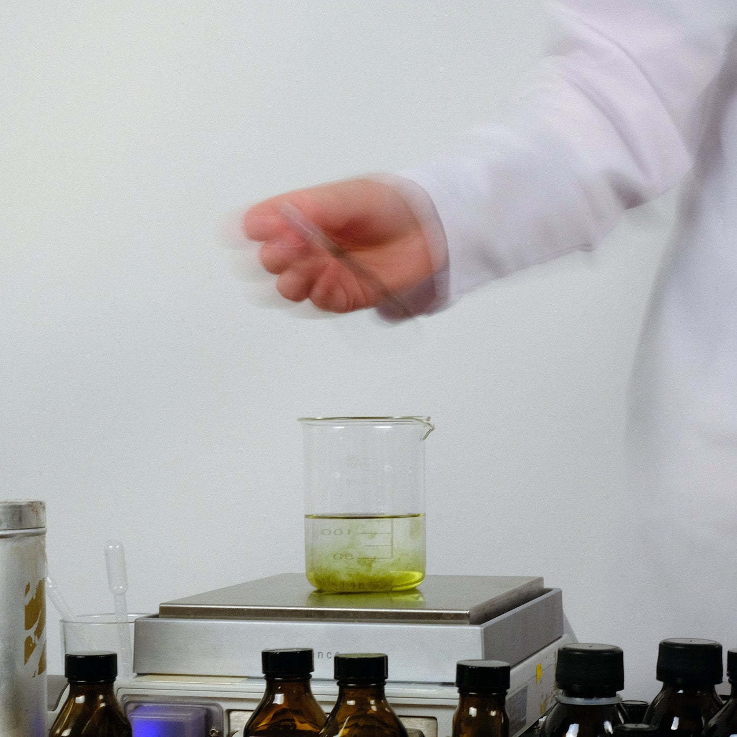 Jorum Studio Mainline Collection image perfumer in lab coat weighing materials
